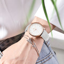 Waterproof quartz watch for students worn on wrist with casual style; rose gold case and white strap visible.